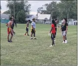  ?? ZACHARY SRNIS — THE MORNING JOURNAL ?? Hard At Work Boys play flag football Sept. 2.