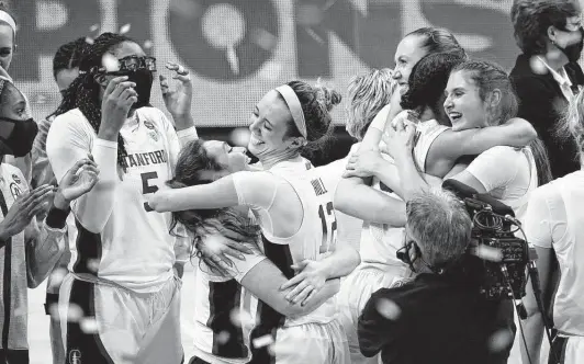  ?? Eric Gay / Associated Press ?? Stanford players celebrate winning the NCAA women’s championsh­ip over Arizona on Sunday in San Antonio. It’s the Cardinal’s third national title.