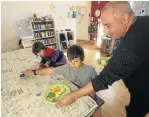  ?? Picture: ESA ALEXANDER ?? FATHER FOOD: Musician Dave Goldberg feeds two of his three children, Jesse, 10, and Gray Rowan-Goldberg, 3, at his home in Fish Hoek, Cape Town. His partner does the nutritiona­l research and he does the buying and cooking, says Goldberg