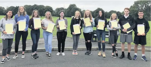  ??  ?? Helsby High School students who made exceptiona­l achievemen­t in gaining at least eight GCSEs graded 7-9/A or A*