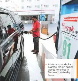  ?? Reuters ?? Amira, who works for Aramco, refuels on her way to her office in Dammam yesterday.