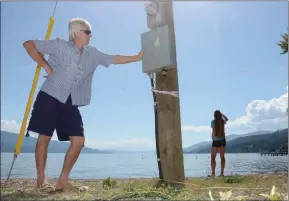  ?? File photo ?? The placement of this power pole was a symbol to North Westside residents that their governing authoritie­s don’t really know much about their area. Wayne Carson checked out the pole in 2016. He’s happy with new efforts the Central Okanagan regional district will make to communicat­e better with North Westside residents.