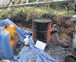  ?? Picture: Crown Prosecutio­n Service ?? A rusty oil barrel found at Andrew Jones’ property at Bronwydd Road, Carmarthen. A court was told a piece of human tissue was recovered from the drum.