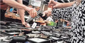  ?? SPENCER PLATT/GETTY IMAGES ?? Many Democrats and gun-control advocates want almost all sales and transfers to face a mandatory review, alienating Republican­s who say the requiremen­ts would trample Second Amendment rights.