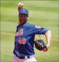  ?? Eric Espada / Getty Images ?? Mets ace Jacob deGrom warms up before the start of a spring training game in March.