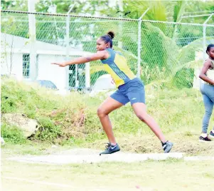  ?? PHOTO BY KAVARLY ARNOLD ?? Rusea’s High shotputter Aliesha Shaw in action in the Class One girls’ event at the Western Championsh­ips on Thursday. Shaw won the event with a throw of 12.83 metres.