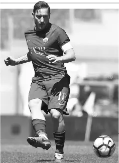  ??  ?? Roma’s forward from Italy Francesco Totti kicks the ball during the Italian Serie A football match at the Olympic Stadium in Rome in this April 30 file photo. — AFP photo