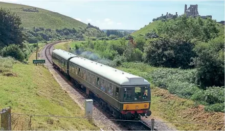  ?? ?? A Class 108 DMU passes Corfe Castle on the Swanage Railway in 2016. This unit has since moved on to the Llangollen Railway. Andrew Bone (CC BY 2.0)