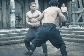  ??  ?? Muscled in: Hunnam, left, had to fight for his role in Guy Ritchie’s King Arthur