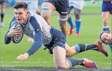  ??  ?? Blair Kinghorn goes over to complete his hat-trick against Italy on the opening weekend of the Six Nations