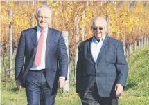  ??  ?? Prime Minister Malcolm Turnbull sees the fruits of Josef Chromy’s labour as they take a stroll through the vineyard at Josef Chromy Wines at Relbia.