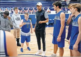  ??  ?? Mount St. Mary basketball player Jacob Brooks, No. 9, listens as coach Brandon Jackson talks to players during practice.