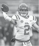  ?? BRUCE NEWMAN, AP ?? Ole Miss quarterbac­k Matt Corral (2) throws a pass the Grove Bowl spring NCAA college football game at Vaught-hemingway Stadium in Oxford, Miss. on Saturday, April 7, 2018.