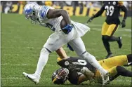  ?? DON WRIGHT - AP ?? Detroit Lions running back D’Andre Swift, top, gets past Pittsburgh Steelers outside linebacker Alex Highsmith (56) during the second half Sunday in Pittsburgh.