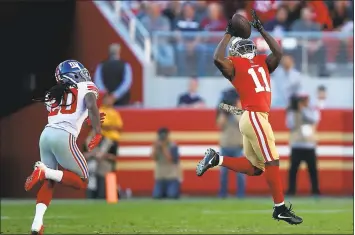  ?? EZRA SHAW — GETTY IMAGES ?? Only hours after his wife lost a baby due to pregnancy complicati­ons Sunday, 49ers WR Marquise Goodwin catches a TD pass.