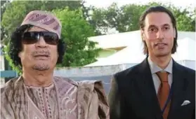  ?? ?? Playboy: Mutassim, right, with his father, Colonel Gaddafi