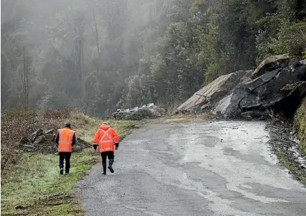  ?? ?? A large rock and other debris block Mangles Valley Rd, near Murchison, which is closed until further notice.