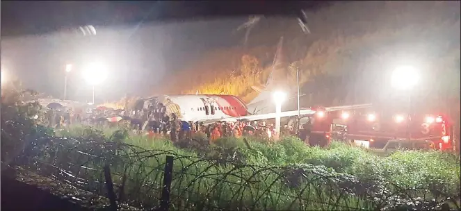  ?? (AP) ?? The Air India Express flight that skidded off a runway while landing at the airport in Kozhikode, Kerala state, India on Aug 7.