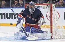  ?? ADAM HUNGER, USA TODAY SPORTS ?? Henrik Lundqvist is below his career averages in save percentage (.915 vs. .920) and goals-against average (2.47 vs. 2.29).