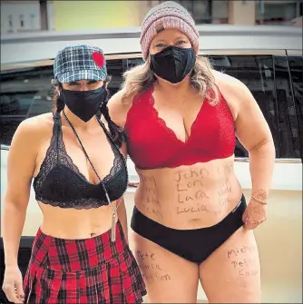  ?? COURTESY REBECCA SOULLIERE / ?? Lisa Layton, left, and Rebecca Soulliere ran in their underwear through Leominster Sunday to raise awareness for neurofibro­matosis.