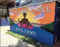  ?? Arkansas Democrat-Gazette/ERIC E. HARRISON ?? A brightly colored sign portends the opening of Live Life Chill in the former Revolution Room restaurant, 300 President Clinton Ave. in Little Rock’s River Market.