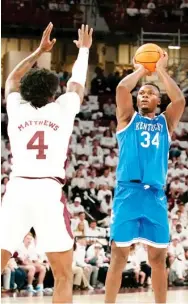  ?? ?? Kentucky forward Oscar Tshiebwe (34) shoots over Mississipp­i State’s Cameron Matthews on Wednesday night. (Photo by Rogelio V. Solis, AP)
