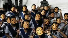  ?? PIC/MPOST ?? School students wearing tiger face masks, at Indian Museum, on Int’l Tiger Day