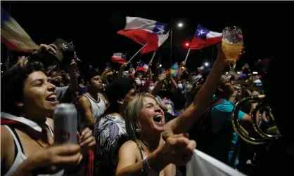  ?? ?? Supporters of Chilean president-elect Gabriel Boric celebrate. Photograph: Claudio Reyes/AFP/Getty Images