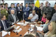  ?? (AP/Dolores Ochoa) ?? Jonathan Parra (center), president of the oversight commission of Ecuador’s National Assembly, speaks Wednesday as he presides over a meeting where Defense Minister Gian Carlo Loffredo (sitting second from left) and Government Minister Monica Palencia (sitting third from right) explain the raid on Mexico’s Embassy in Quito, Ecuador.