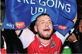  ?? Tom Sandberg/PPAUK ?? An emotional Pierce Sweeney, involved in three play-off final defeats in the last five years with Exeter, finally celebrates promotion