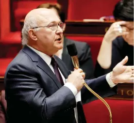  ??  ?? PARIS: French Economy and Finance Minister Michel Sapin speaks during a session of questions to the government at the French National Assembly in Paris yesterday.—AFP