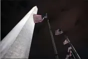  ?? MANUEL BALCE CENETA — THE ASSOCIATED PRESS ?? American flags fly around the Washington Monument on Friday in Washington.