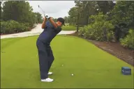  ?? Mike Ehrmann / TNS ?? NFL quarterbac­k Tom Brady of the Tampa Bay Buccaneers plays his shot from the 11th tee during The Match: Champions For Charity at Medalist Golf Club on Sunday in Hobe Sound, Fla.