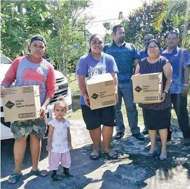  ??  ?? Sisters Faith Raduva (From left), Eunice Raduva and AnnMary Raduva receiving donations from Asaleo Care team for their dignity drive in Suva.