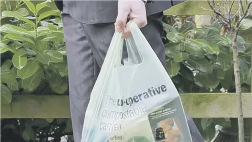  ??  ?? The Co-op will ban single-use plastic bags and reduce use of plastic packaging within five years