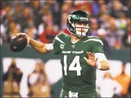  ?? Al Bello / Getty Images ?? Jets QB Sam Darnold passes against the Patriots on Monday night.