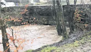  ?? Leanne Lewicki ?? ● Waters rose close to the bridge at Fox Hill, Oswaldtwis­tle.