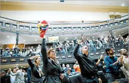  ?? ARIANA CUBILLOS/AP ?? Opposition lawmakers cry out claims of fraud during a session of Venezuela’s National Assembly on Wednesday in Caracas. Controvers­y surrounds Sunday’s turnout figure.