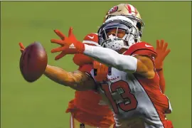  ??  ?? The Cardinals’ Christian Kirk fails to catch a pass while being guarded by the 49ers’ Emmanuel Moseley in the fourth quarter at Levi’s Stadium on Sunday.