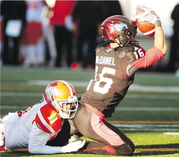  ?? — POSTMEDIA ?? Calgary’s Marquay McDaniel comes down with a touchdown during the Stamps’ 42-15 season-ending victory over B.C. Sunday.