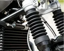  ??  ?? Front fork is convention­al but offers 125 mm of travel and places a 19-inch wheel; rake angle is a more relaxed 29°