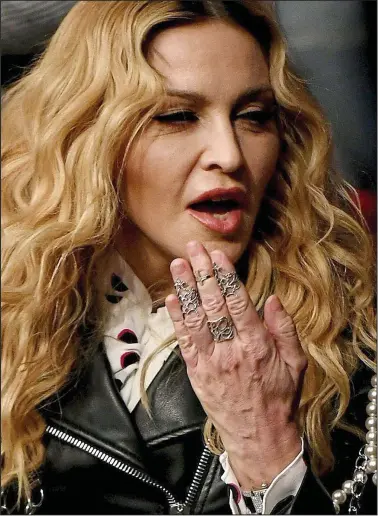  ??  ?? Giveaway: Madonna has a youthful complexion but her hands tell a different story