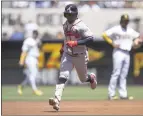  ?? KYUSUNG GONG – THE ASSOCIATED PRESS ?? Ozzie Albies rounds the bases after homering during the first inning for one of the Braves' three long balls in Saturday afternoon's 5-2 victory against the Padres in San Diego.