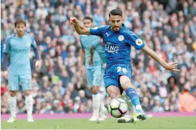  ?? — Reuters ?? Leicester City’s Riyad Mahrez scores from the penalty spot but it is disallowed for kicking the ball twice.