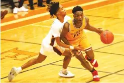  ?? STAFF FILE PHOTO BY TROY STOLT ?? Howard senior Meechie Bowens (10) recently joined the 1,000-point club for his high school career. Bowens has helped the Hustlin’ Tigers to a 6-1 start this season.