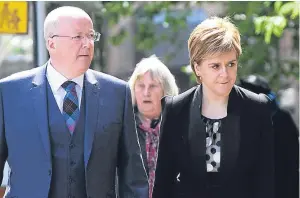  ?? Pictures: Mhairi Edwards. ?? Above: Alex Salmond, left, and Dundee MSP Shona Robison are joined by First Minister Nicola Sturgeon, far right, at the funeral of Gordon Wilson.