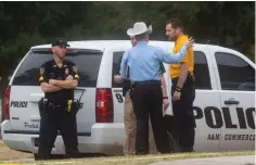  ?? The Dallas Morning News via AP ?? ■ Law enforcemen­t officers gather Monday outside of the Pride Rock residence hall following a shooting at Texas A&M University-Commerce in Commerce, Texas.