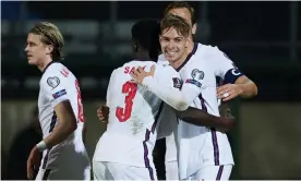  ?? Photograph: CPS Images/Getty Images ?? Emile Smith Rowe is hugged by Arsenal teammate Bukayo Saka after scoring his first England goal against San Marino.