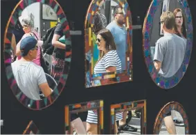  ?? Andy Cross, Denver Post file ?? Artistic mirrors from Mountain Mosaics in Conifer are on display at the annual People’s Fair at Civic Center park in 2017.