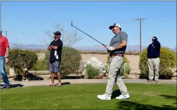  ??  ?? LEFT PHOTO: Jeremy Tucker (right) is presented the 90th annual Elmer Sears Lettuce Golf Tournament trophy after beating Blaise Smith in the championsh­ip flight Sunday at Del Rio Country Club in Brawley. Lettuce tournament Chairman Bruce Smith presented...